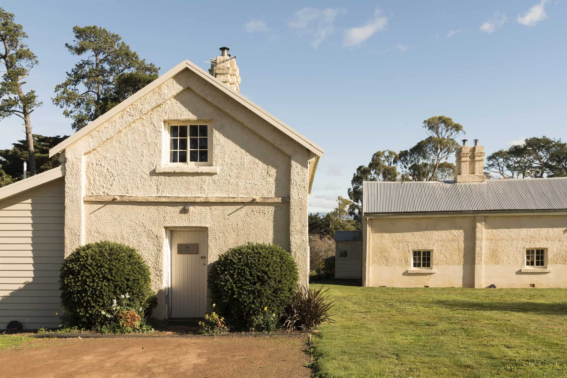 Cottage exterior with stone chimney