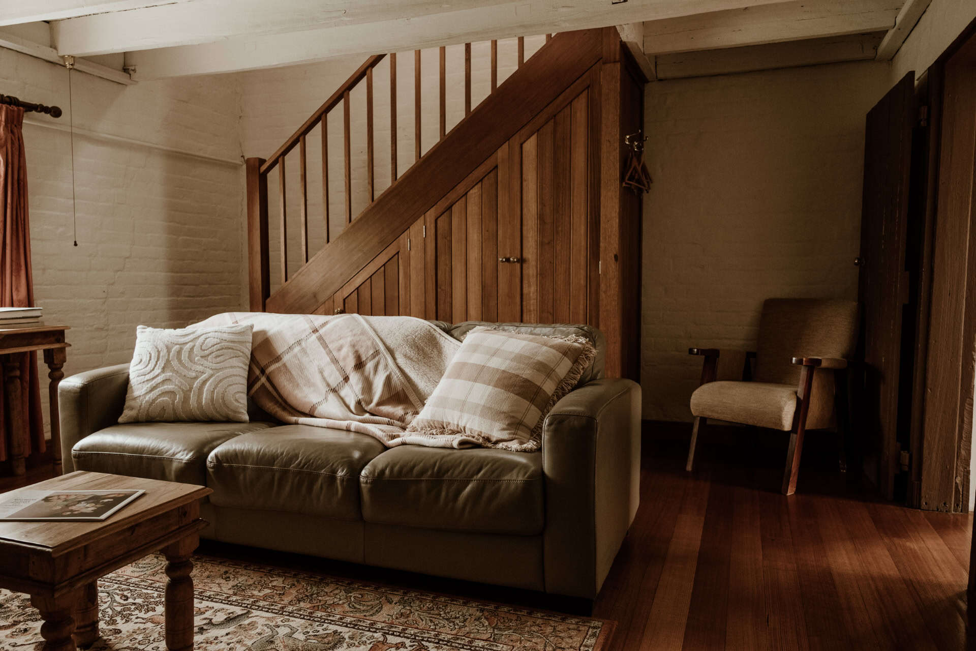 Cosy lounge with timber staircase